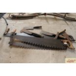 A quantity of cross cut saws, two hand hooks and a