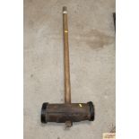 A large metal bound wooden mallet, possibly ex-cir