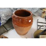 A large glazed earthenware crock