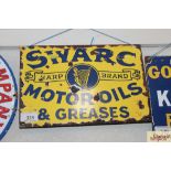 A "Swarc Motor Oils and Greases" enamel advertisin