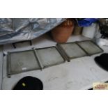 A section of vintage car window / windscreen panel
