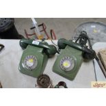 Two old green dial telephones