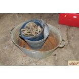 A small galvanised bath, a pail and rope etc.