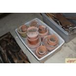 A quantity of old terracotta flower pots