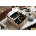 A box containing various small tools including spa