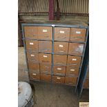A large steel cabinet with twenty drawers