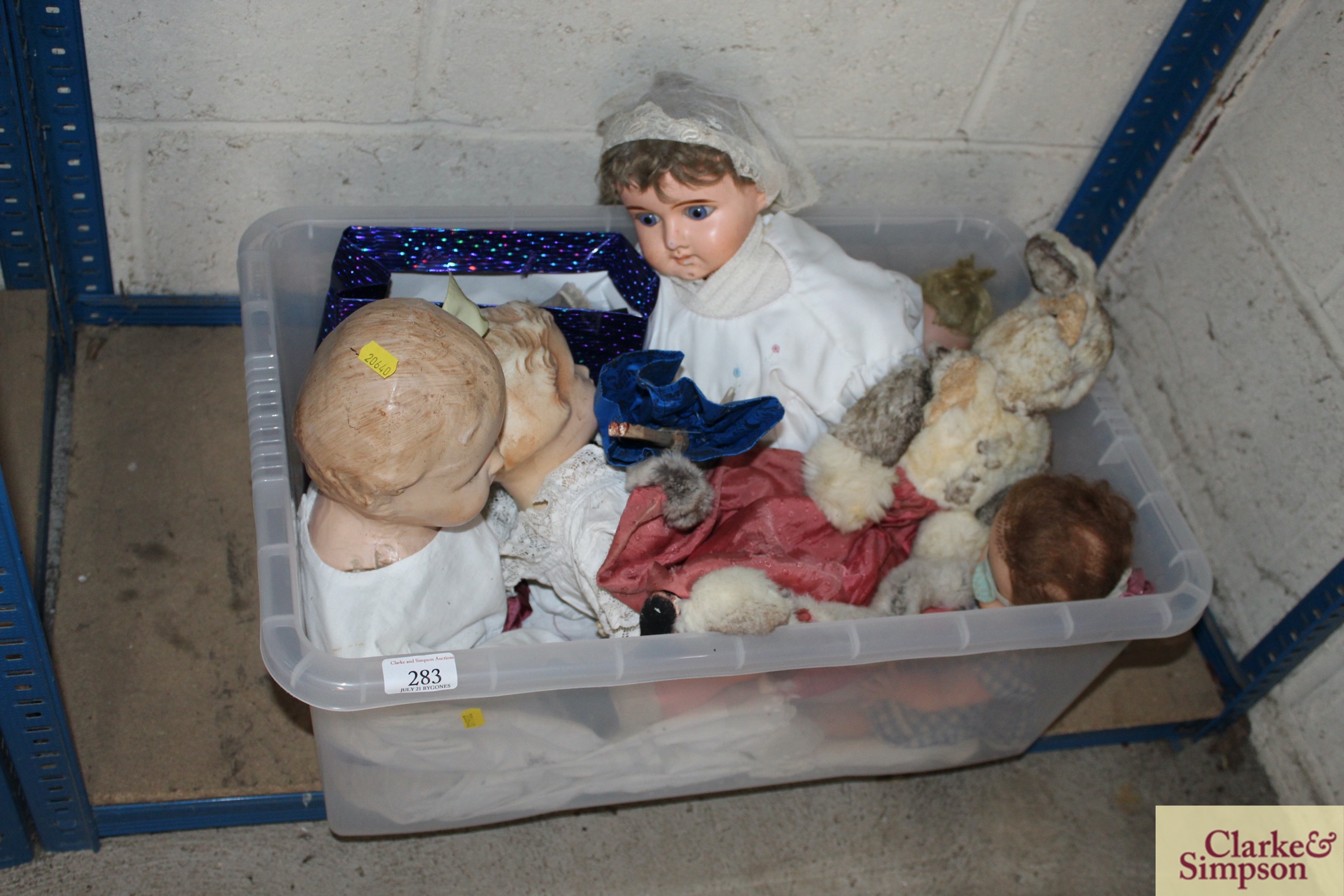A box of miscellaneous vintage dolls and soft toys