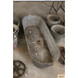 A large galvanised bath