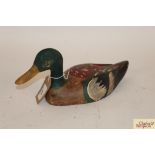 A painted wooden decoy duck