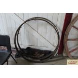 A pair of vintage metal cartwheel rims