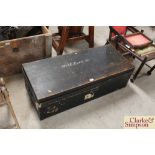 A large wooden and brass cornered travelling trunk (with
