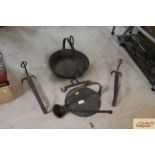 A pair of fireplace hangers, together with a 9" skillet,