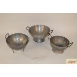 Three vintage colanders