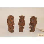 Three carved wooden monkeys