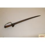 An antique curved sword, the serrated blade with b