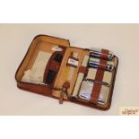 A cased vintage gent's chrome mounted grooming set