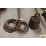 Four cast iron quoits and a cast iron weight