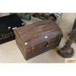 A Victorian japanned dome top tin trunk