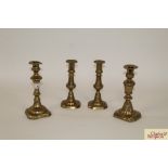 A pair of antique brass candlesticks 7" high and