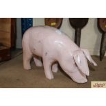 A wooden model of a pig