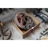 A vintage wooden wheel barrow wheel, a cast iron w