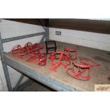 Various painted metal saddle and bridle racks, hoo