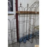 A pair of large wrought metal garden obelisks with