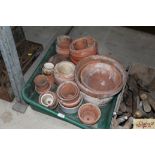 A quantity of old terracotta flower pots