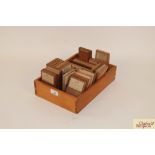 A box containing a quantity of wood specimens, som