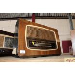 A Regentone walnut and Bakelite cased radio