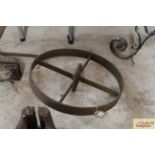 A cast iron wheel barrow wheel