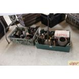 Two boxes containing various oil cans, oil jugs, h