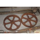 A pair of approx. 20" dia. cast iron wheels