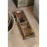 A small cast iron two division trough