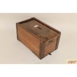 A 19th Century pine offertory box with lock and ke