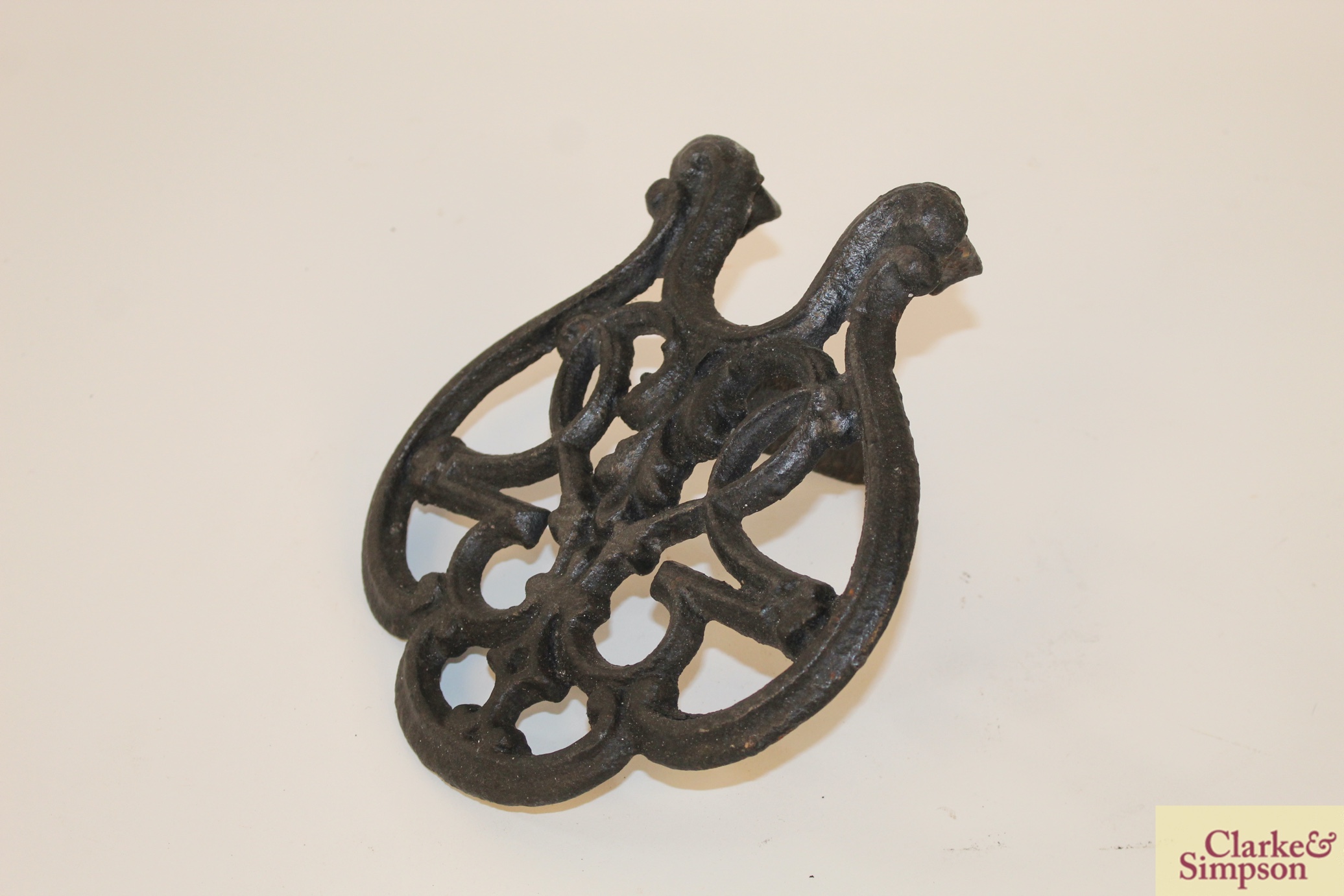 Four various ornate cast iron trivets; two flat ir - Image 8 of 20