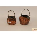 Two small Victorian copper warming jugs, each wit