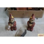 A pair of vintage cast iron garden gnomes