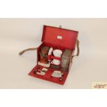 A vintage leather cased picnic set and contents