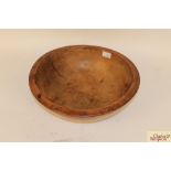 A large 19th Century sycamore dairy bowl with rive