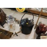 A Swain three gallon cast iron swing handled kettl