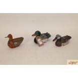 Three small model ducks
