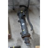 A vintage cast iron water pump