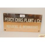 A polished and lacquered 1930's bronze Trade sign