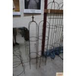 A pair of wrought metal medium sized garden obel