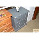 A painted three drawer pine chest