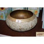 A decorative brass bowl