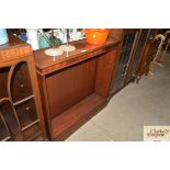 A reproduction open fronted mahogany bookcase