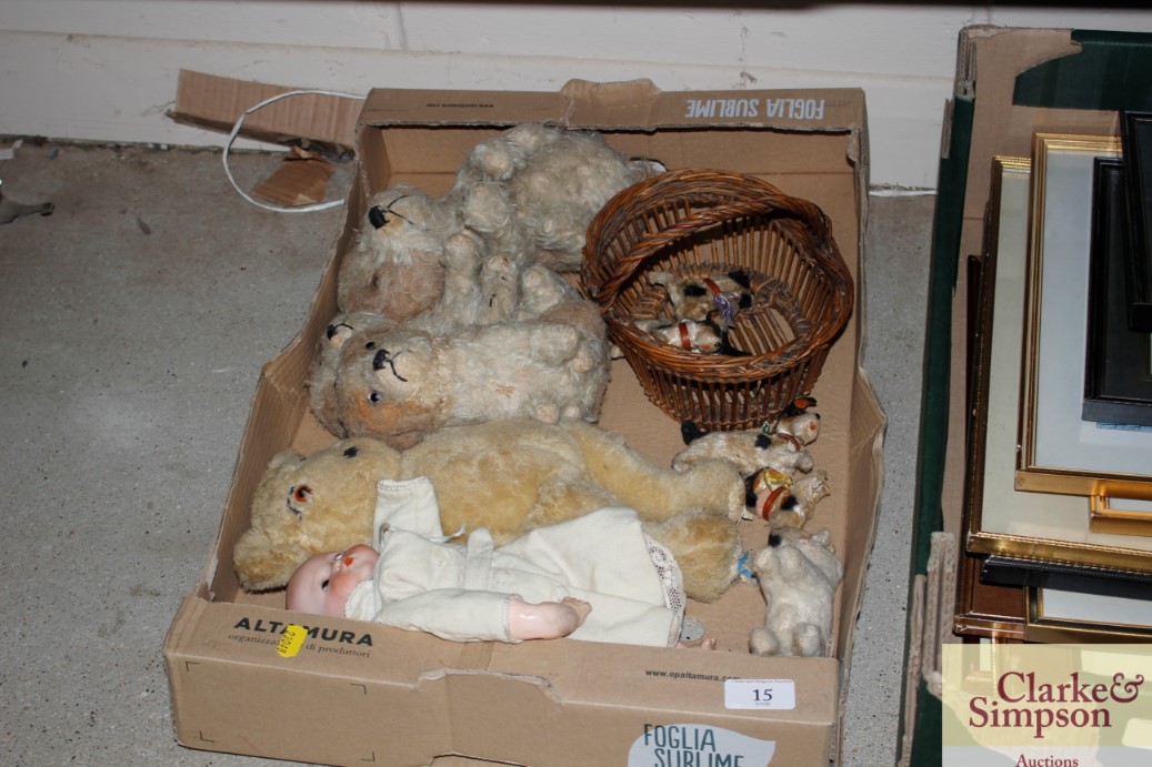 A box containing various teddy bears a German porcelain headed doll etc.