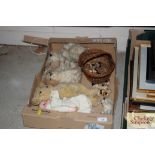 A box containing various teddy bears a German porcelain headed doll etc.